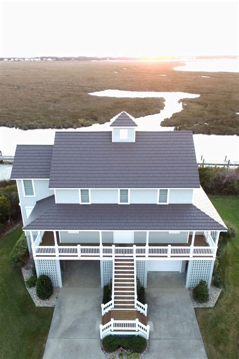 small beach house metal roof elevated designs|coastal exterior metal roof.